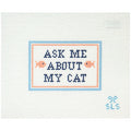 Needlepoint canvas with 'Ask Me About My Cat' text on a white background with coral fish.