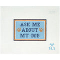 Needlepoint Canvas with 'Ask Me About My Dog' text on a light blue background with paw prints.