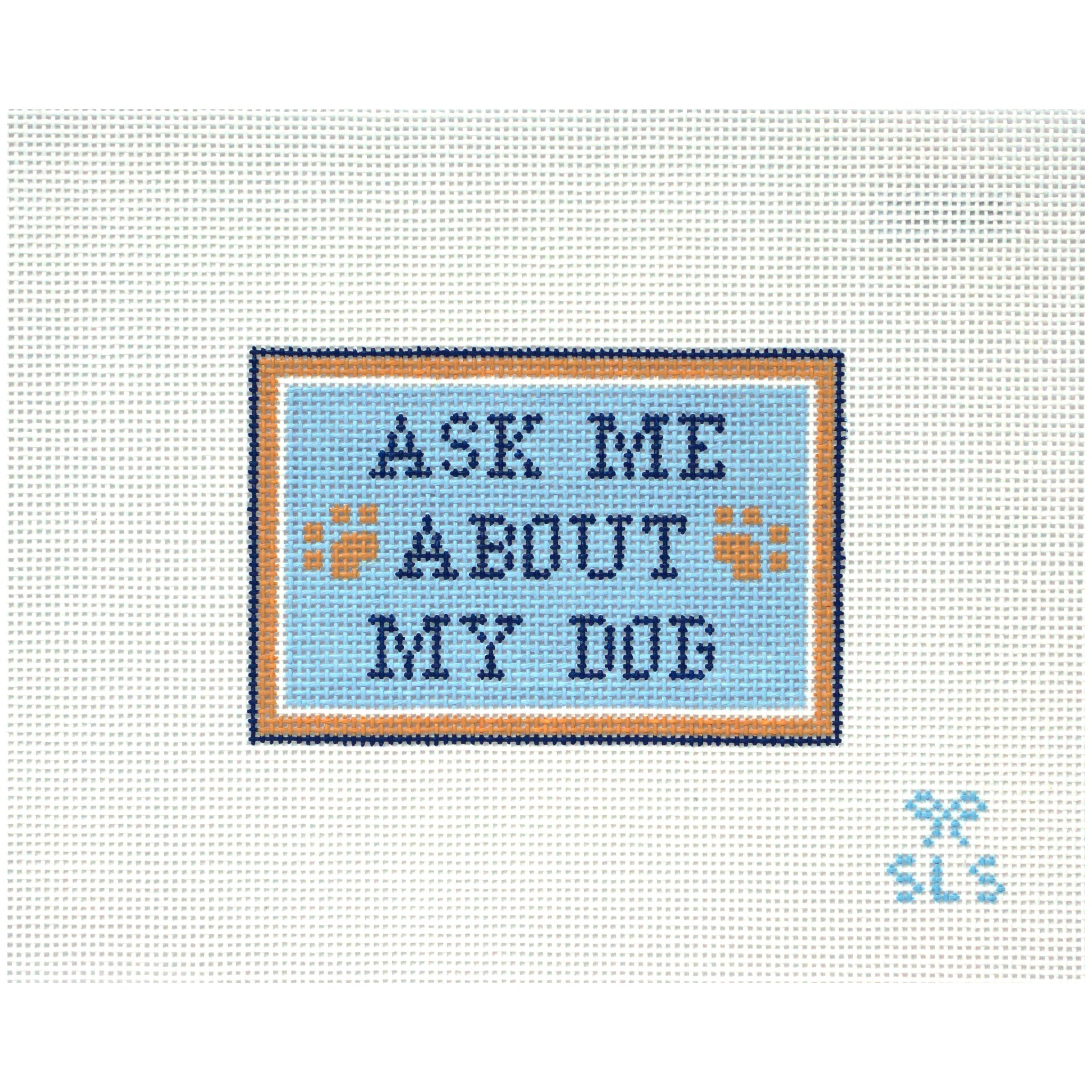 Needlepoint Canvas with 'Ask Me About My Dog' text on a light blue background with paw prints.