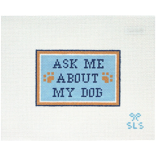 Needlepoint Canvas with 'Ask Me About My Dog' text on a light blue background with paw prints.