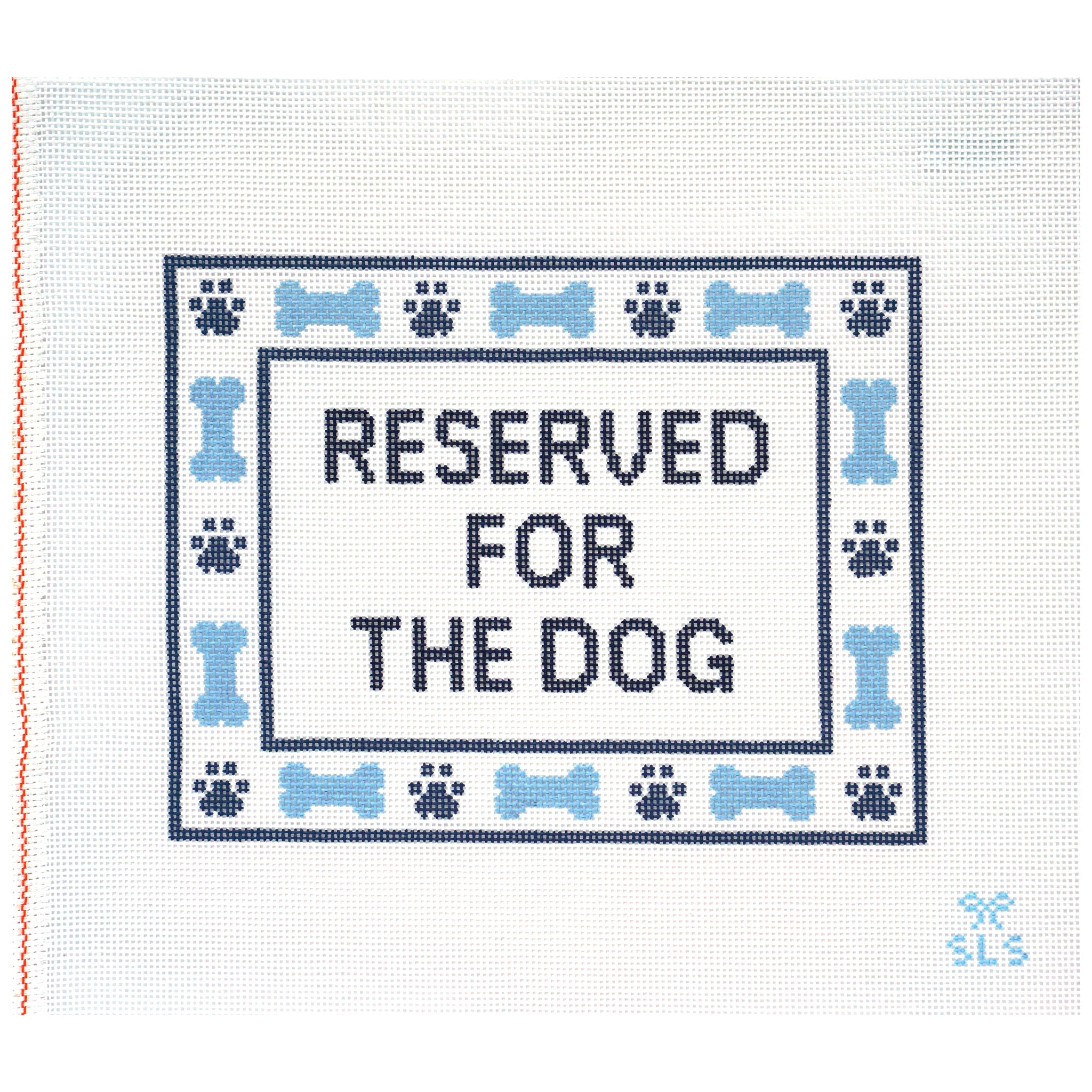 Needlepoint Canvas with 'Reserved for the Dog' text and blue bone and paw print patterns.