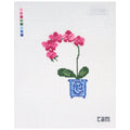 Needlepoint Canvas design of pink flowers in a blue pot on a white fabric background.