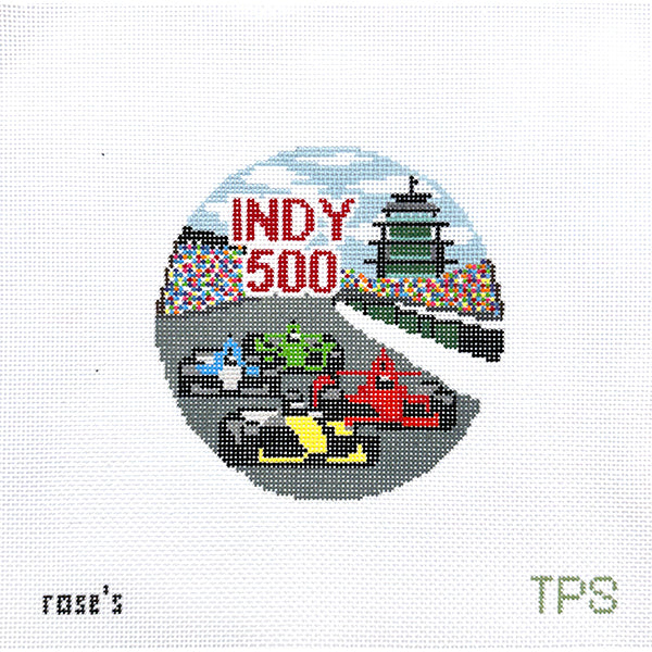Needlepoint canvas design of the indianapolis motor speedway race track with Indy 500 race cars and the pagoda in the background.
