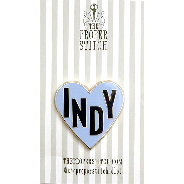 A needle minder design of a blue heart with the word "INDY" in the center to represent Indianapolis.