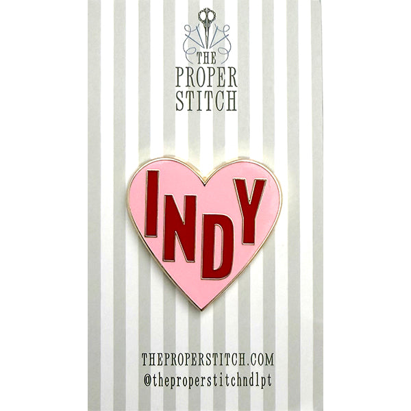 A needle minder design of a pink heart with the word "INDY" in the center to represent Indianapolis.