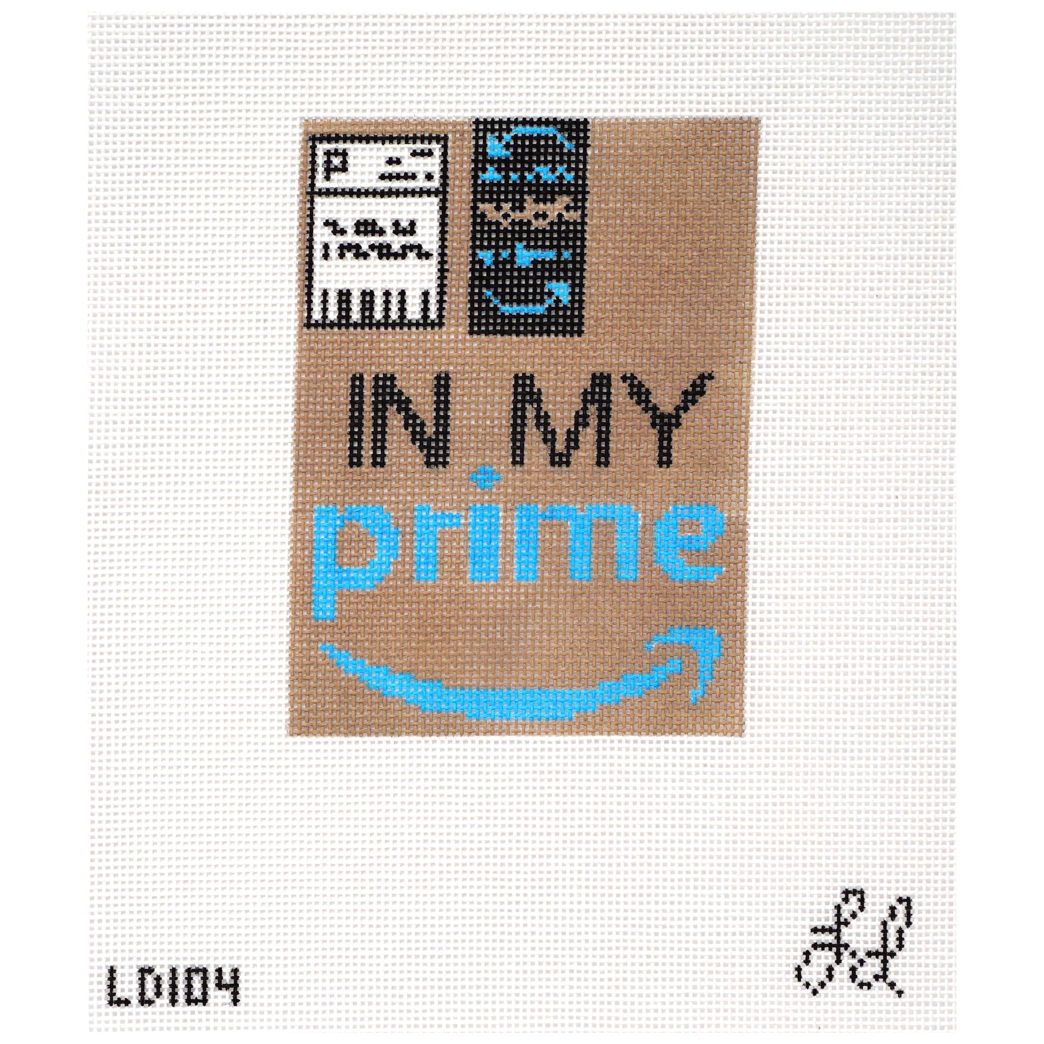 Needlepoint canvas design of a brown package with "In My Prime" written on it.