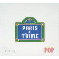 Needlepoint canvas of a sign with 'PARIS JE T'AIME' text on a white background.