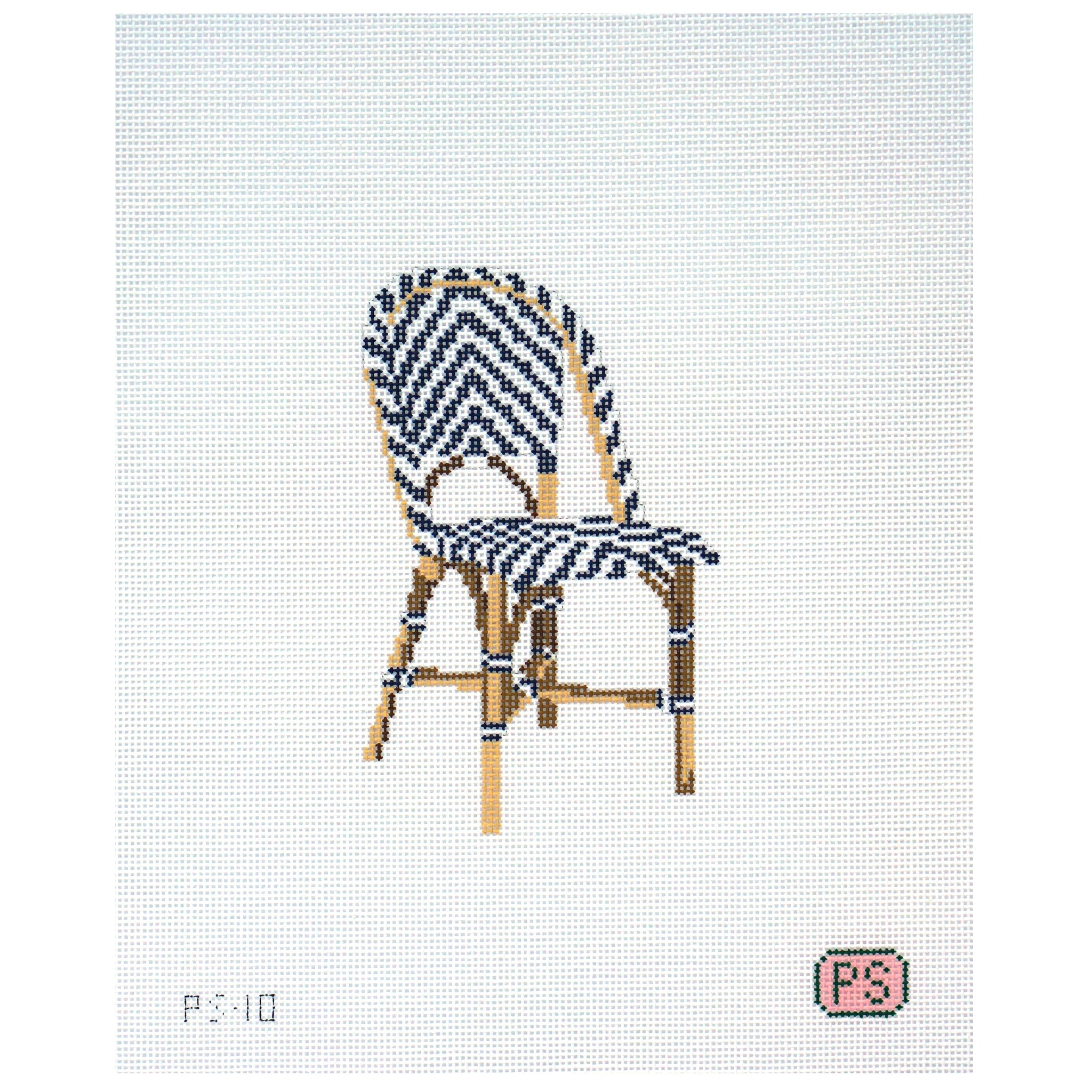 Needlepoint canvas of chair with a blue and white pattern on a white background