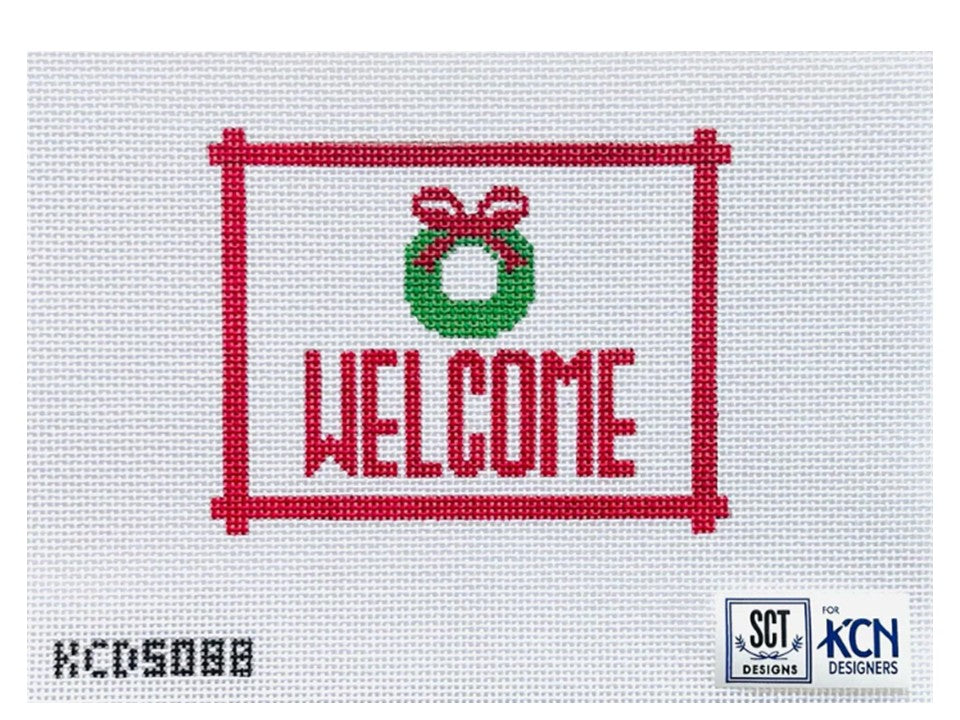 Welcome Sign with Red Wreath